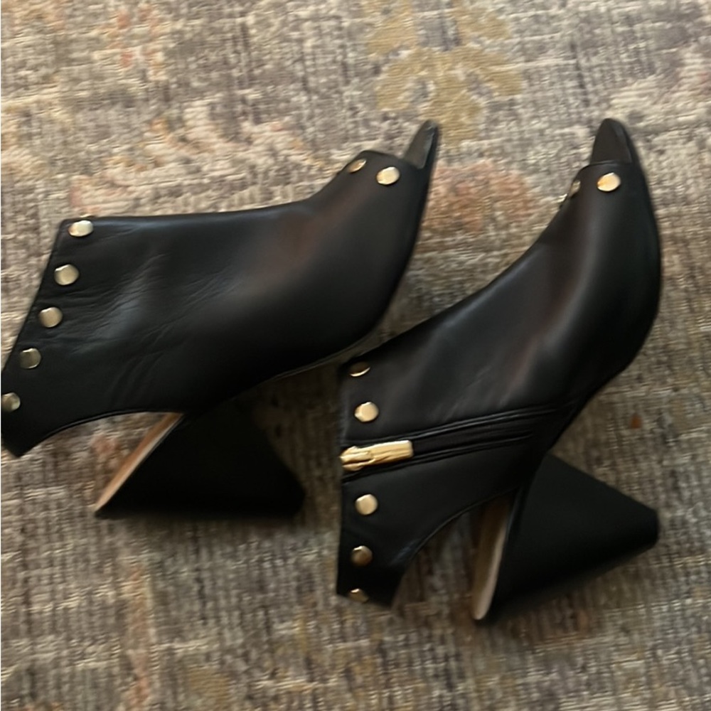 Vince Camuto black leather wedges size 10.  Like new with some wear at toe line.